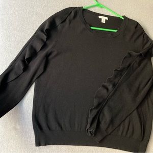 Black long sleeve knit top. Size Xl. Embellished ruffle sleeves.